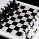 Illustration for article titled This Typographic Chess Set Is Too Pretty to Play